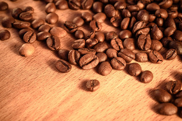 coffee grains on grunge wooden background