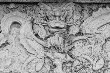Carved stone dragon in Chinese temple.