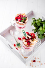 dessert in a glass on a wooden tray