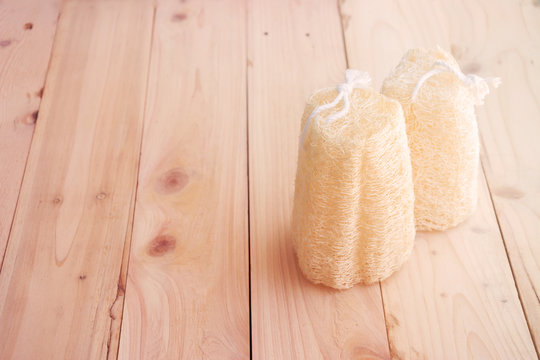 shower equipment made from fiber of zucchini on wood pallet background