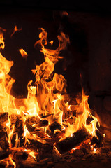 Closeup image of fire from burning woods logs