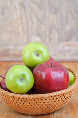 red and green apples in basket