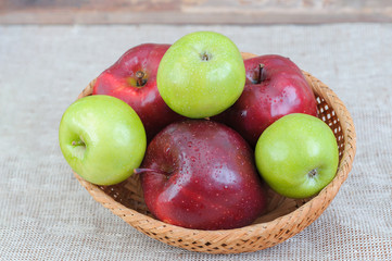 mixed apples in basket on the table