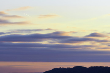 Pink, blue and orange early morning sky before sunrise