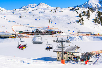 View of chairlifts and beautiful winter scenery in Obertauern ski resort, Austria