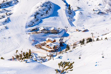 View of mountain hotels and restaurants covered with fresh snow in Obertauern winter resort, Austria
