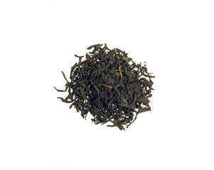 Pile of leaves of black tea Assam, isolated on white background