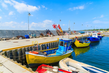 Obraz premium Colorful fishing boats anchoring in Kuznica port on Hel peninsula, Baltic Sea, Poland