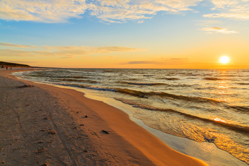 Sunset over sandy beach in Leba, Baltic Sea, Poland