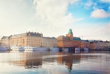 Fototapeta premium Scenic waterfront panorama of the Old Town in Stockholm, Sweden, retro toned