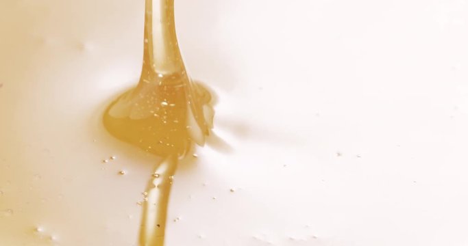 Slow motion of honey drips from wooden dipper, 4k 60fps prores footage