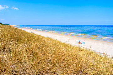 Fototapeta na wymiar Grass sand dune and beach view in Lubiatowo, Baltic Sea, Poland