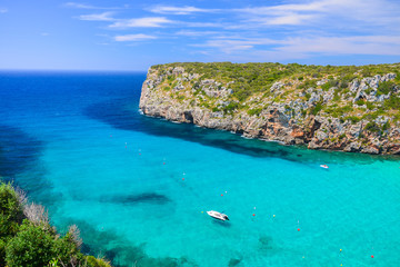 Fototapeta na wymiar View of Cala Porter bay with turquoise sea water, Menorca island, Spain
