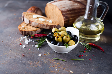 Fresh bread with olive oil and olives