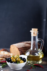 Fresh bread with olive oil and olives