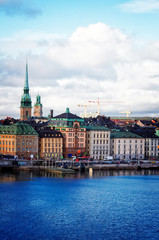 old town waterfront and ships of Stockholm, Sweden, retro toned