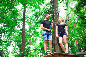 Hiking in the rope park two young people