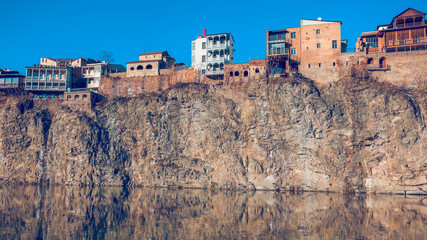 Houses on the edge of a cliff above the river Kura. Tbilisi, the © k_samurkas