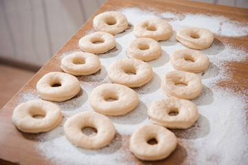 Chef preparing dough - cooking donuts process