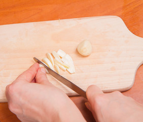 Fototapeta na wymiar Garlic being chopped