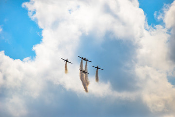 planes flying in blue sky leavin a trail