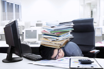 Tired manager resting with paperwork