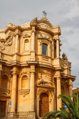 Fototapeta na wymiar Baroque facade of the church in the historic part of Noto, Sicil
