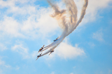 planes flying in blue sky leavin a trail