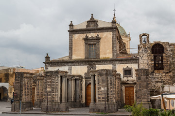 Fototapeta na wymiar Church with unfinished facade in the historic centre of Adrano,