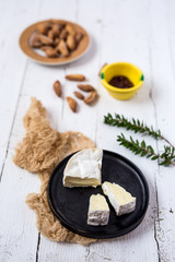 Camembert cheese with breadsticks and marmalade