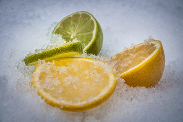 Fresh fruits, lemon and lime on the ice