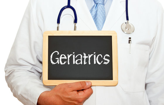 Doctor With Geriatrics Chalkboard On White Background