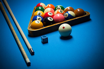 Photo fragment of the blue pool billiard game with cue. Pool bil