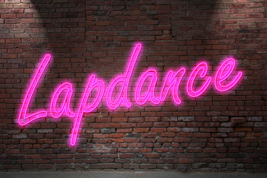 Leuchtreklame Lapdance an Ziegelsteinmauer