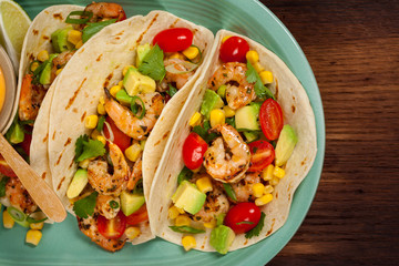 Shrimp Tacos with Corn and Avocado Salsa. Selective focus.