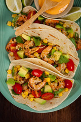 Shrimp Tacos with Corn and Avocado Salsa. Selective focus.