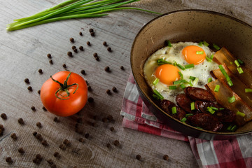 Ukrainian light breakfast. Breakfast in the pan on a wooden background