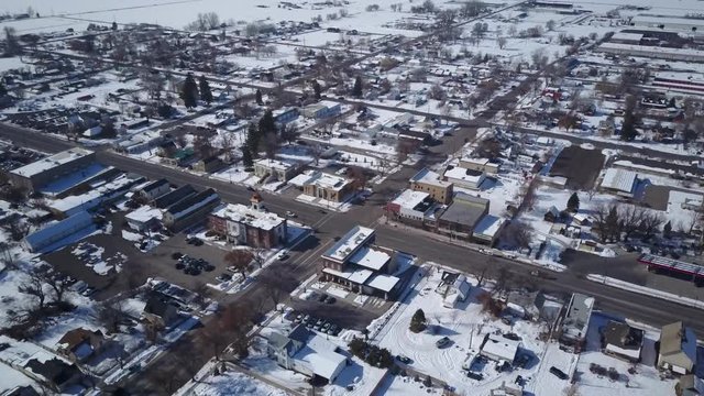 Aerial Ephraim Utah rural city business section drone. Surveillance spy aerial point of view. Winter storm and blizzard. Seasonal weather. Hazard to driving. Surveillance spy.