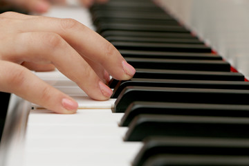 Close up piano, white and black keyboard