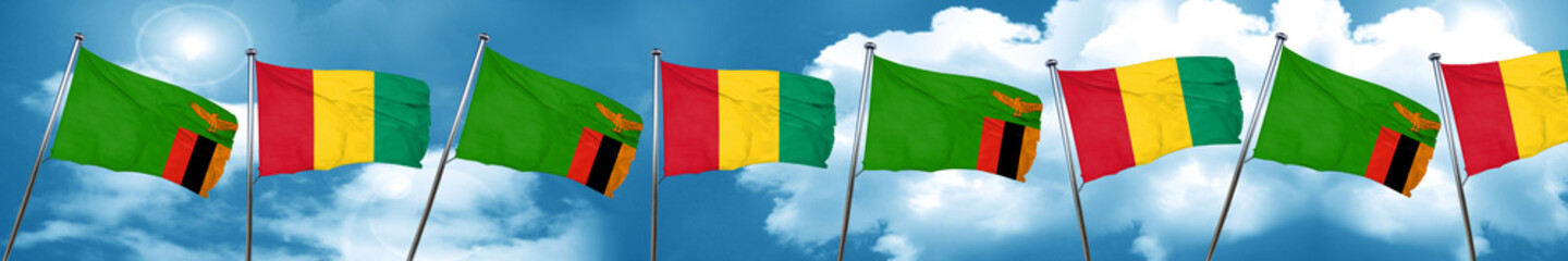 Zambia flag with Guinea flag, 3D rendering