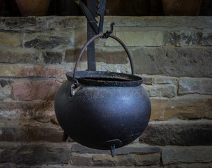 The old and ancient cauldron in a farmhouse