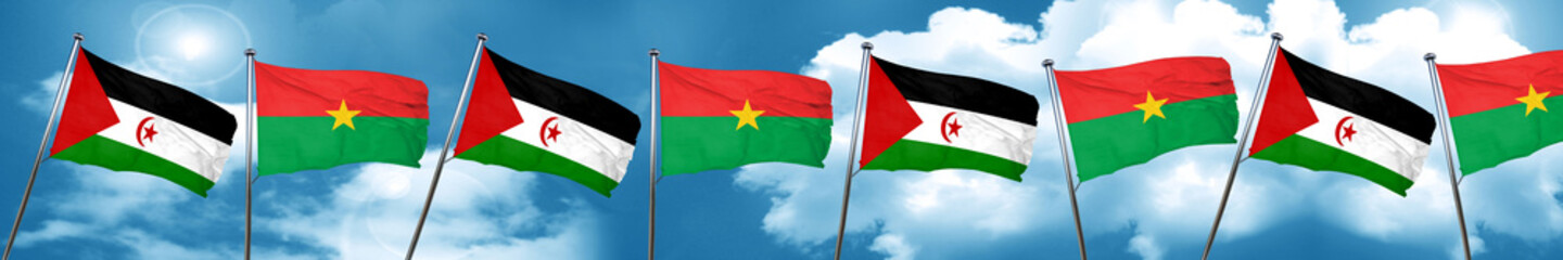 Western sahara flag with Burkina Faso flag, 3D rendering