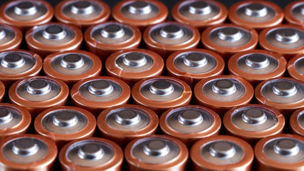 Close up of positive ends of AA batteries, aspect ratio 16:9