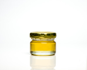 Transparent jar of liquid honey