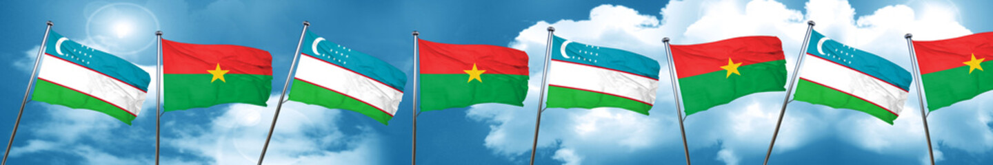 Uzbekistan flag with Burkina Faso flag, 3D rendering