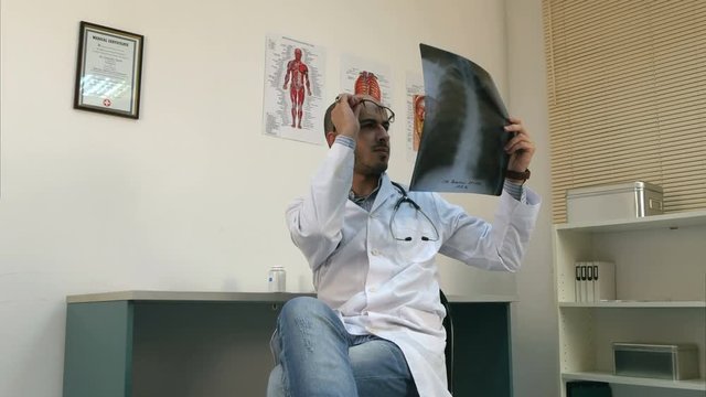 Medical worker analyzing chest x-ray image