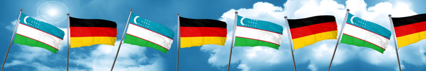 Uzbekistan flag with Germany flag, 3D rendering