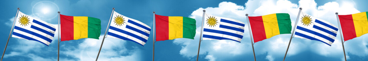 Uruguay flag with Guinea flag, 3D rendering