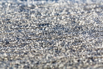 Frost water drops background in morning shiny siver light