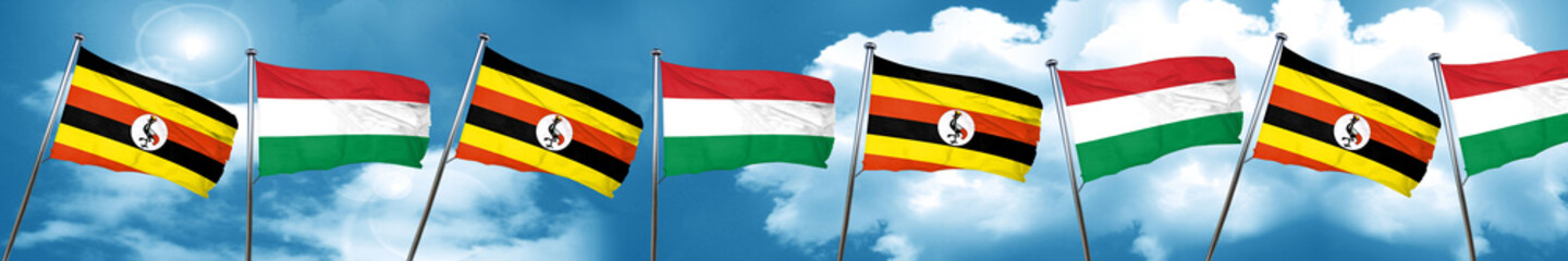 Uganda flag with Hungary flag, 3D rendering